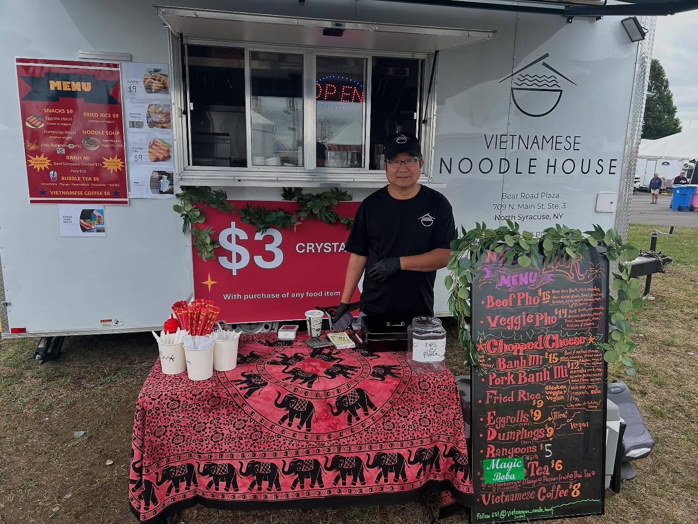 Vietnamese Noodle House food truck with staff serving at the window