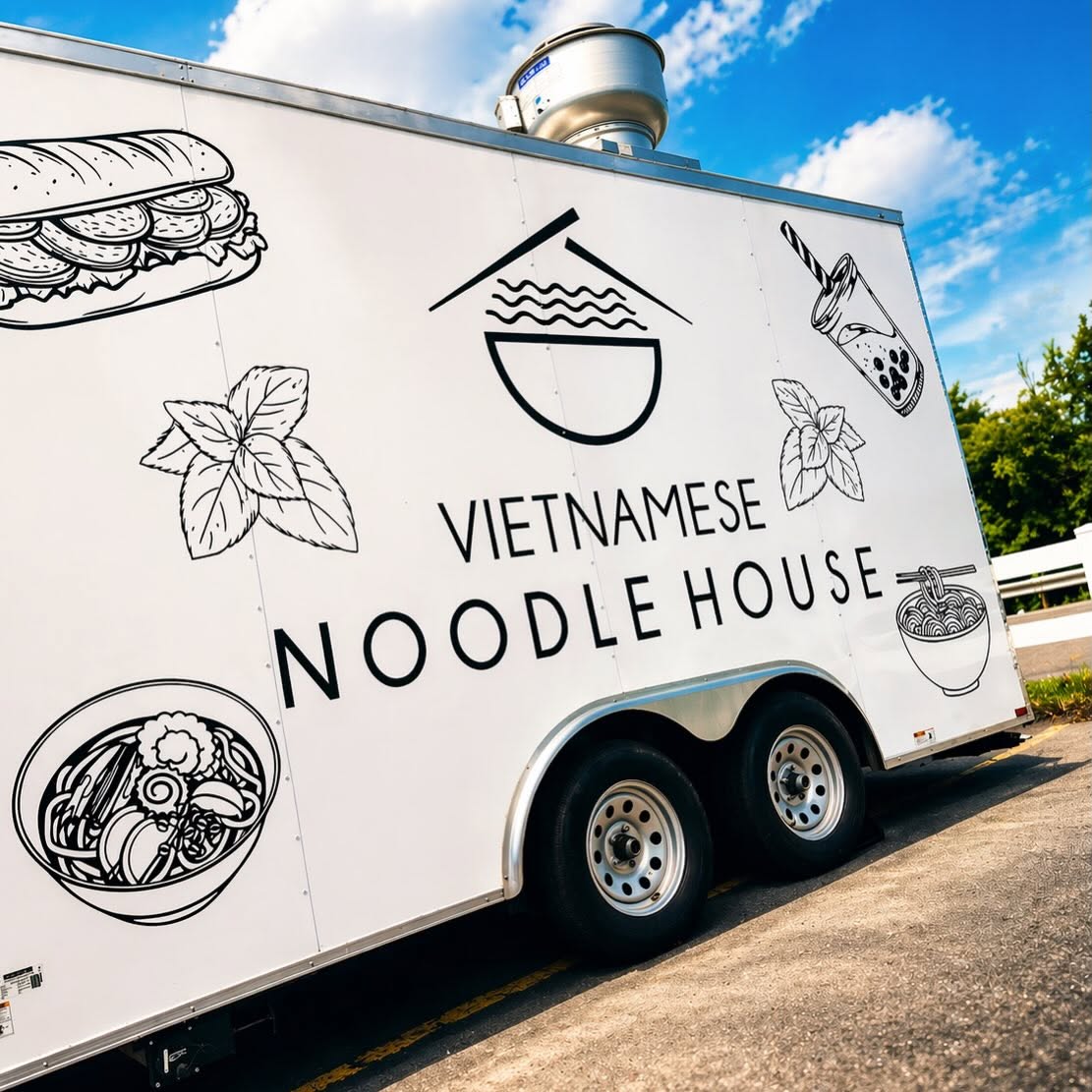 Side of the Vietnamese Noodle House food truck with hand-drawn banh mi, herbs, and noodle bowl graphics